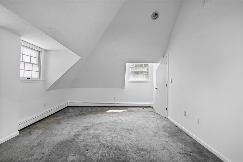 93 West R W Emerson, Unit 93R Melrose, MA 02176 - Photo 13 of 21 an empty room with windows