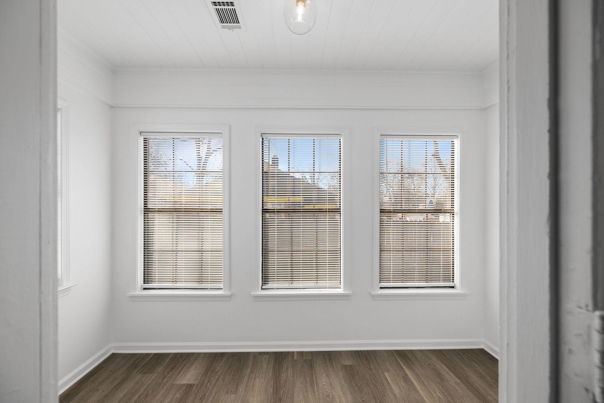 1120 Parkland Road Memphis, TN 38111 - Photo 13 of 23 Unfurnished room featuring healthy amount of natural light and wood finished floors