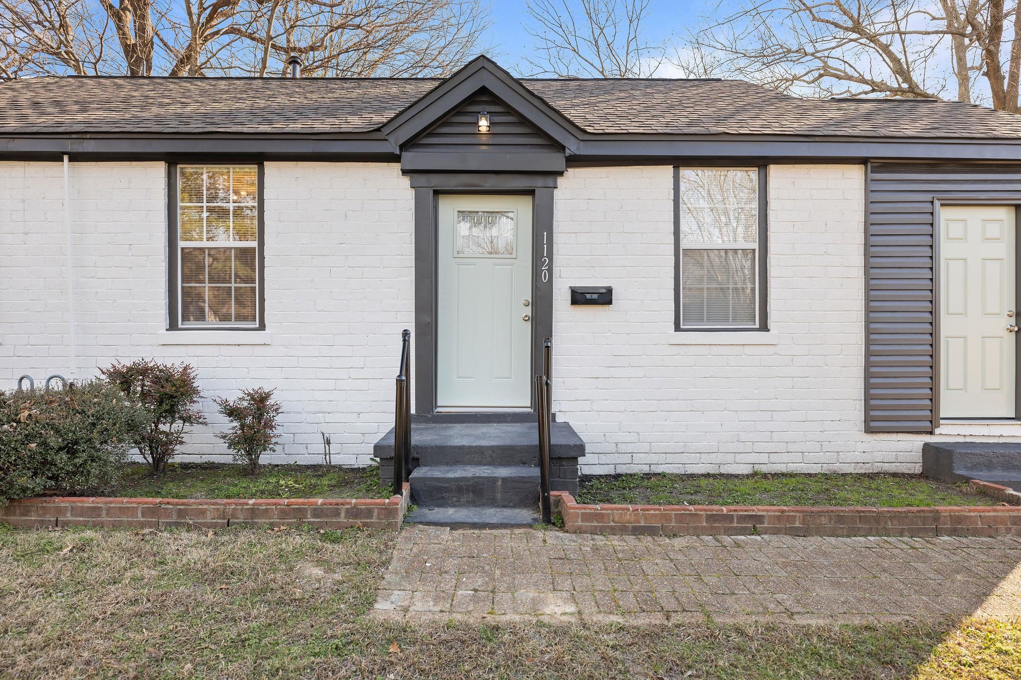 1120 Parkland Road Memphis, TN 38111 - Photo 3 of 23 View of front of home featuring roof with shingles and brick siding