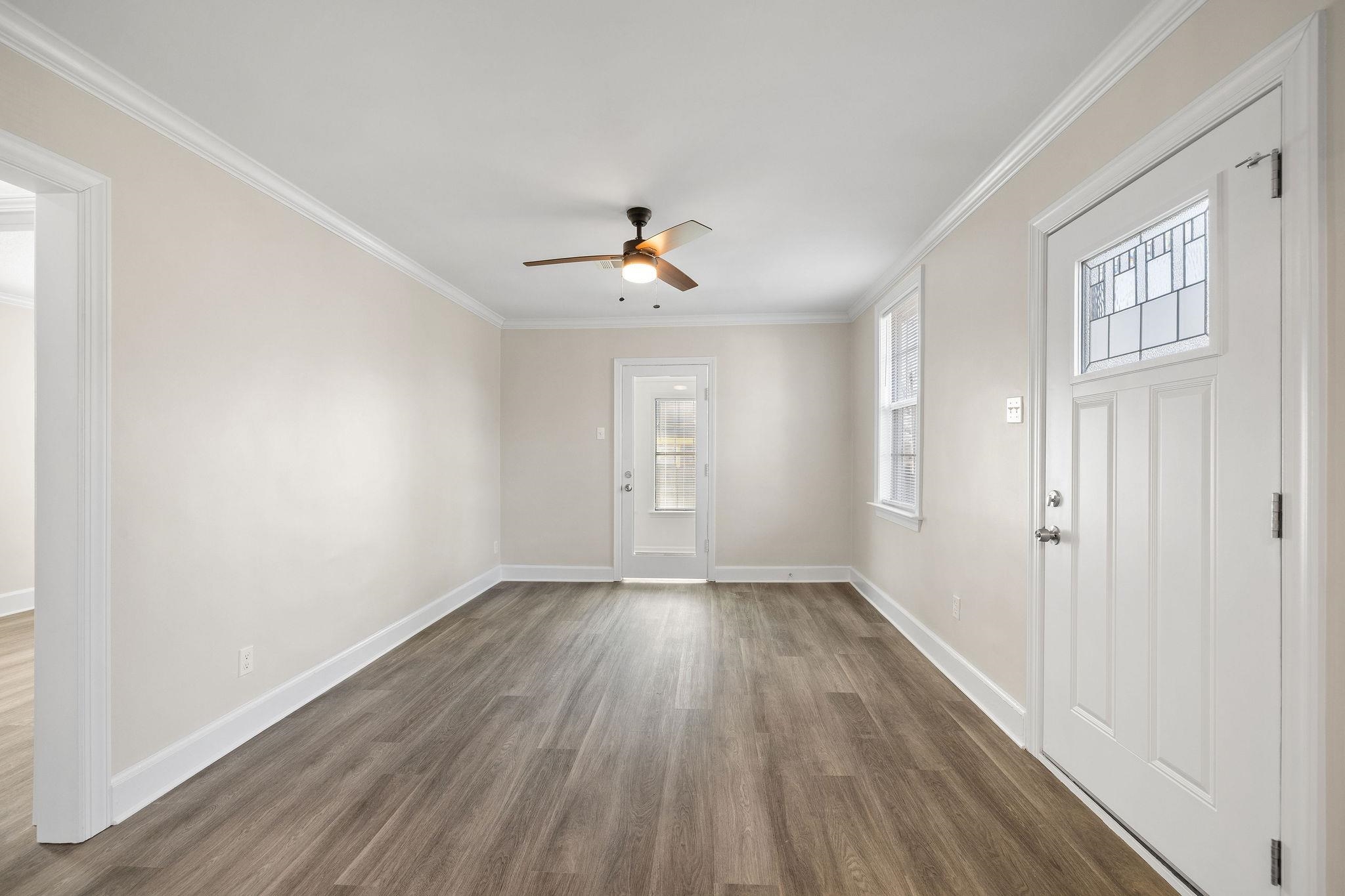 1120 Parkland Road Memphis, TN 38111 - Photo 7 of 23 Entryway featuring ornamental molding, dark wood-style flooring, and ceiling fan