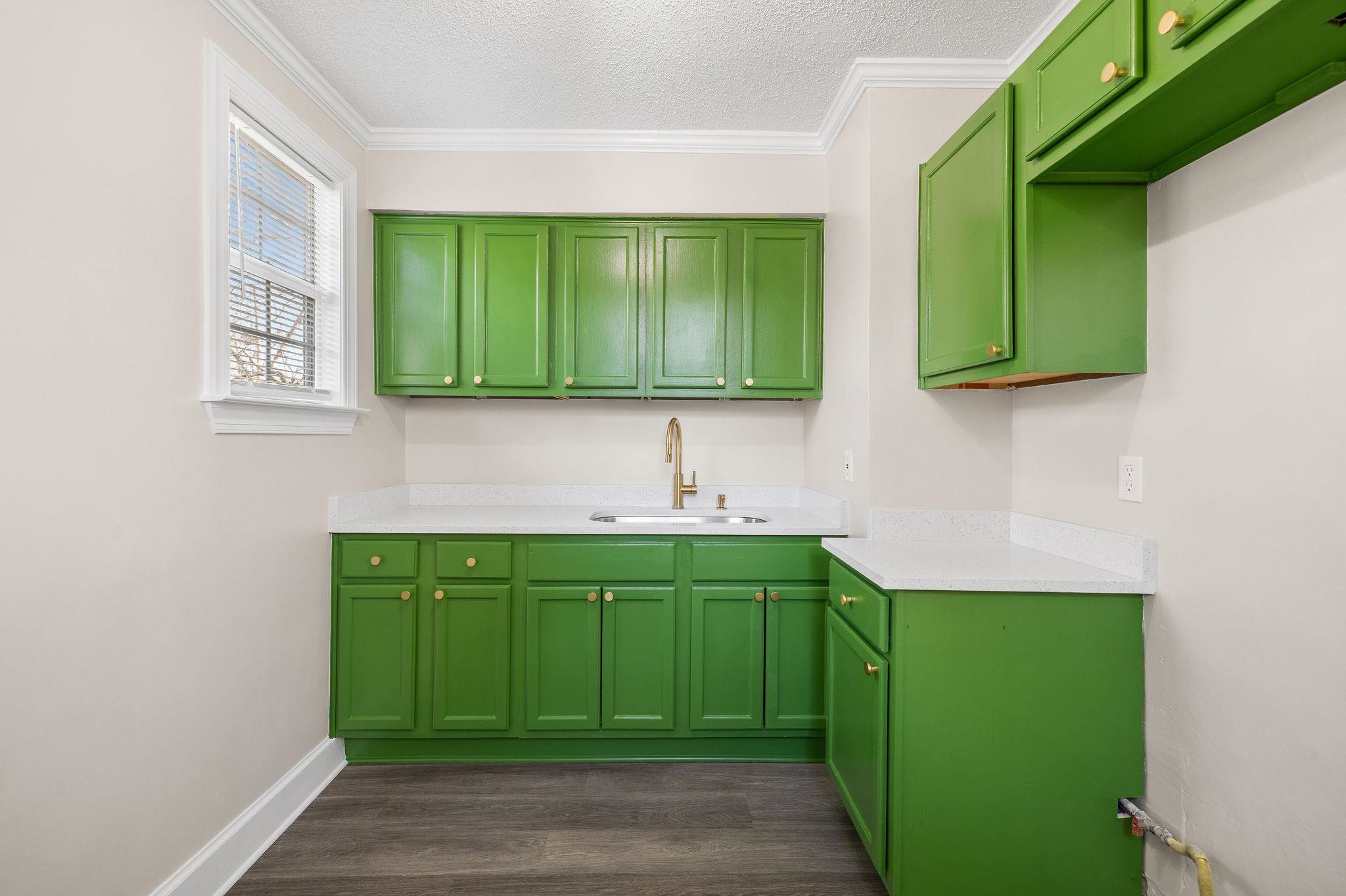 1120 Parkland Road Memphis, TN 38111 - Photo 8 of 23 Washroom featuring a textured ceiling, dark wood-style floors, and ornamental molding