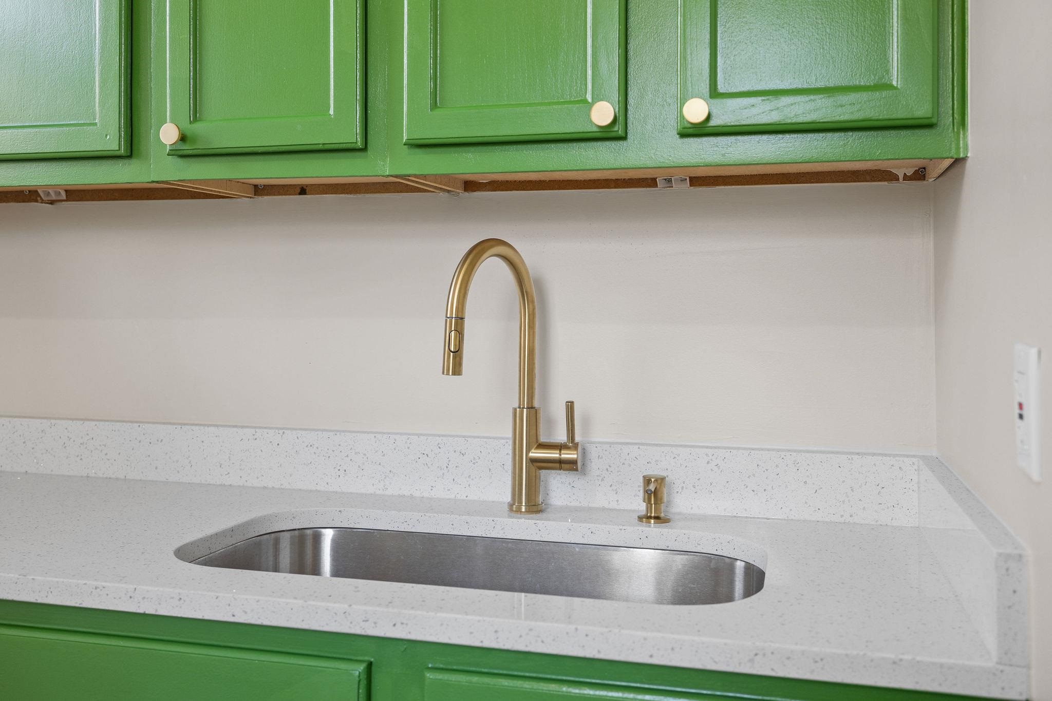 1120 Parkland Road Memphis, TN 38111 - Photo 9 of 23 Kitchen view of green cabinets and light stone countertops
