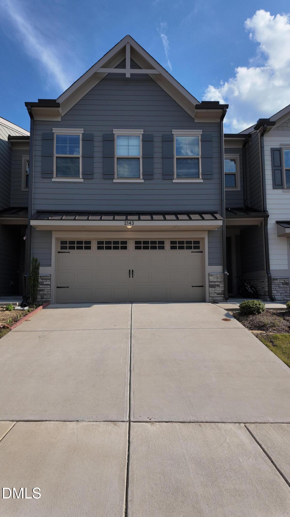 a front view of a house with yard