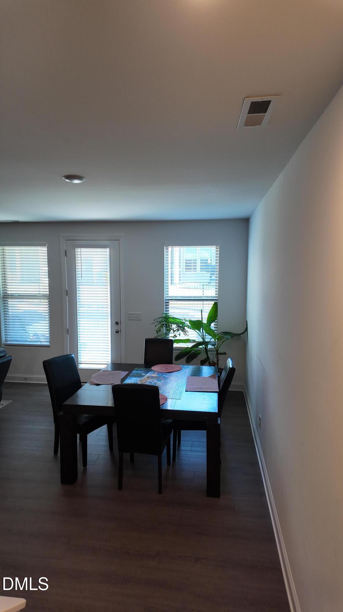 2143 Stegemann Street Apex, NC 27502 - Photo 9 of 39 a view of a workspace with furniture window and wooden floor