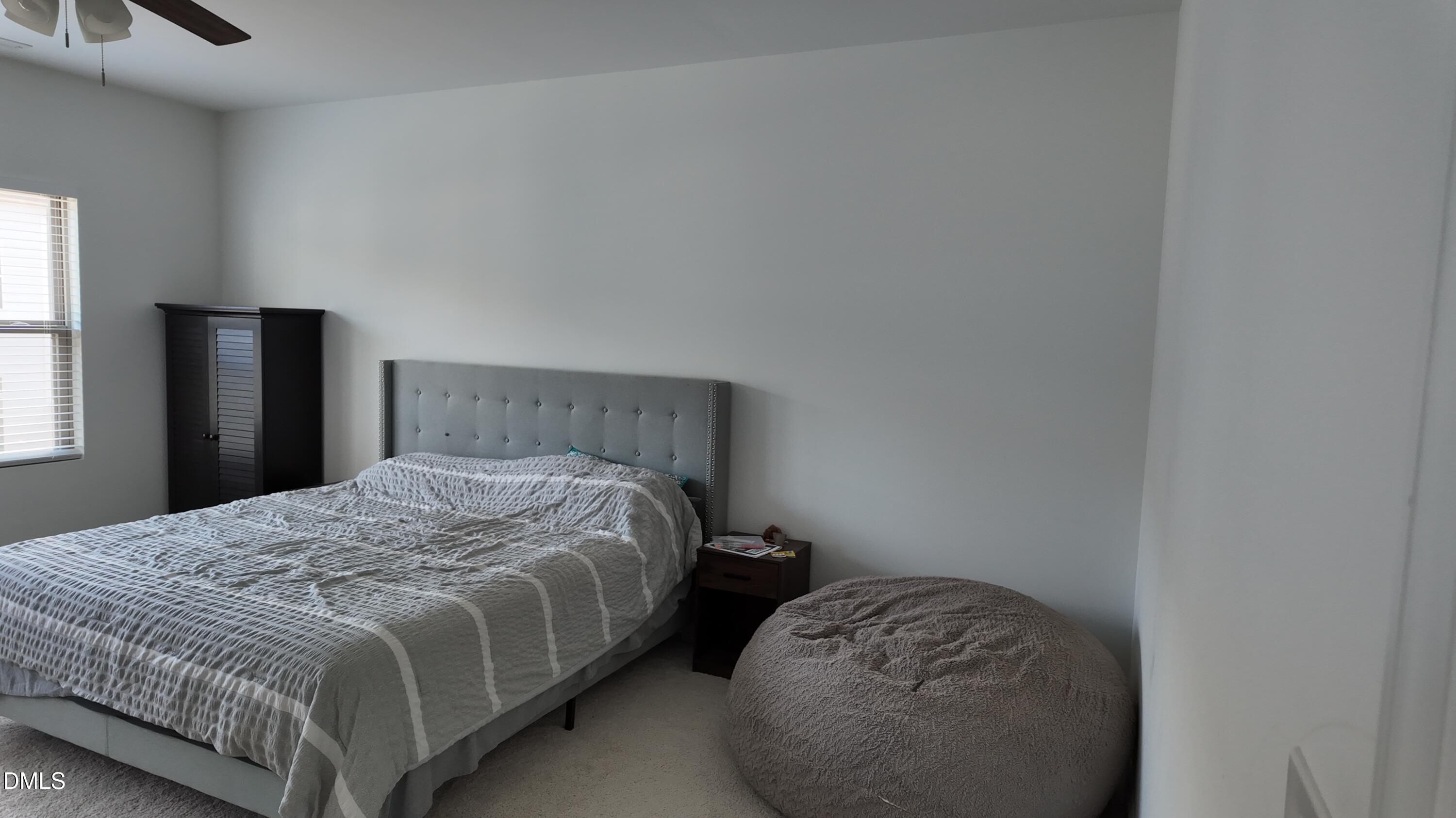 2143 Stegemann Street Apex, NC 27502 - Photo 20 of 39 a bedroom with a bed and a window