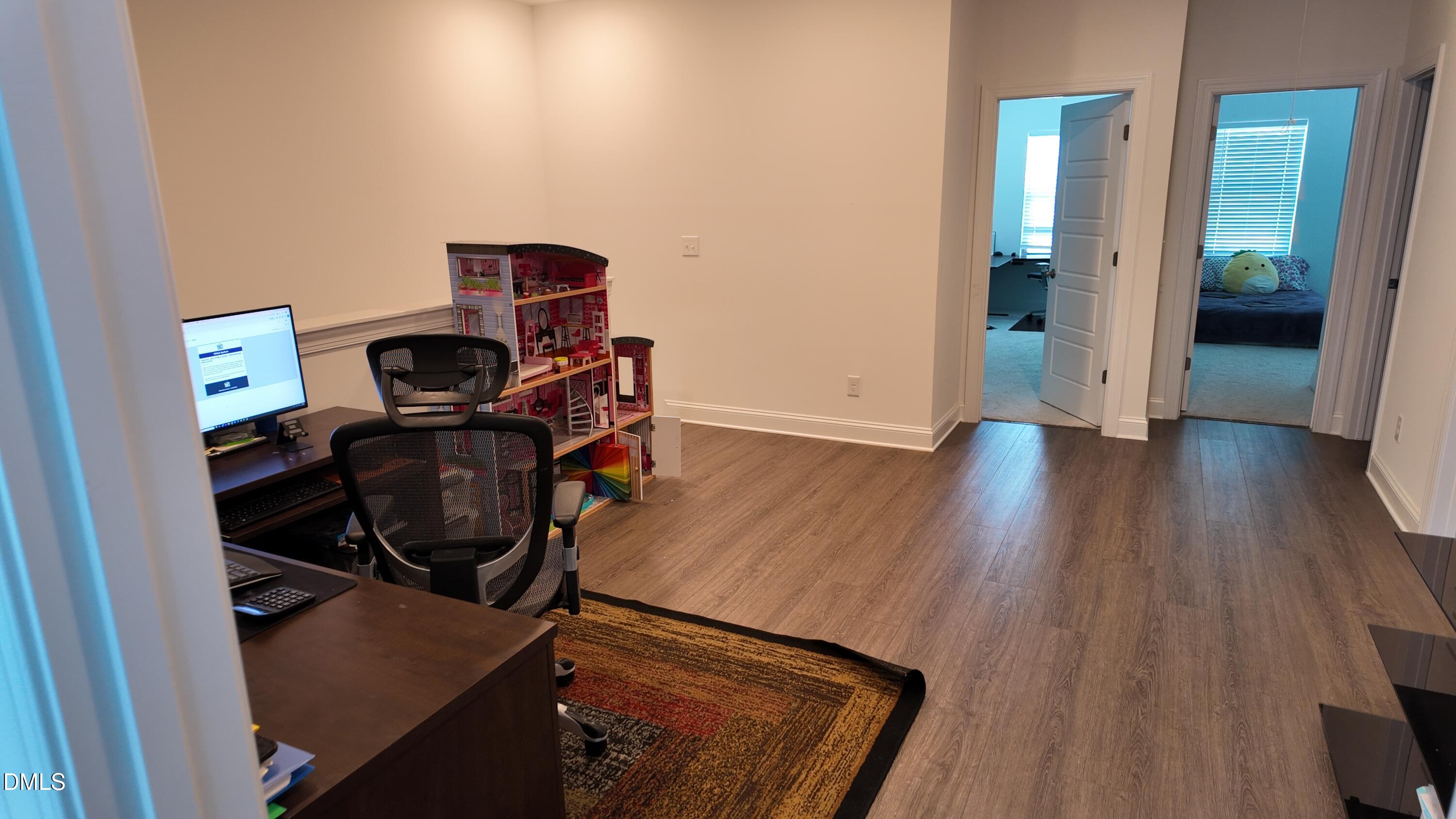2143 Stegemann Street Apex, NC 27502 - Photo 28 of 39 a view of workspace with wooden floor