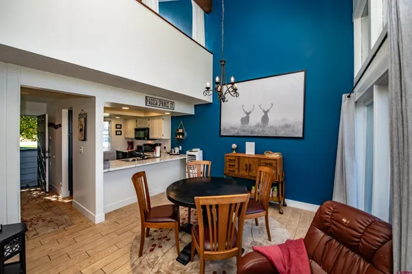 a dining room with furniture and window