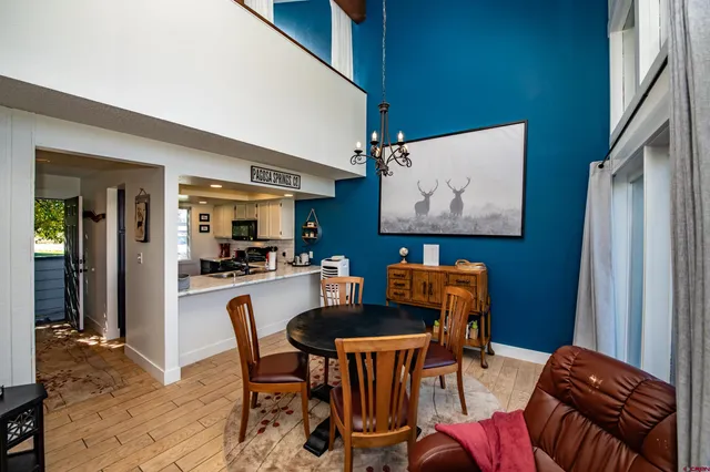 a dining room with furniture and window