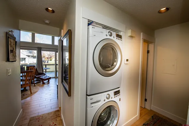 a view of a hallway with washer and dryer