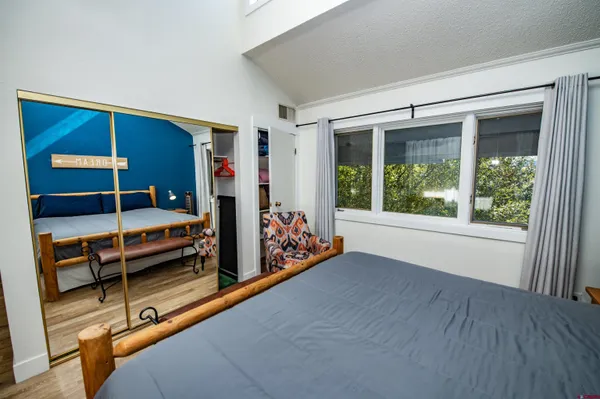 a bedroom with furniture and a window