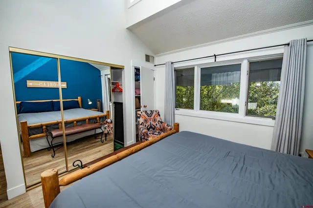 a bedroom with furniture and a window