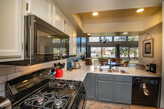 a large kitchen with lots of counter space and a sink