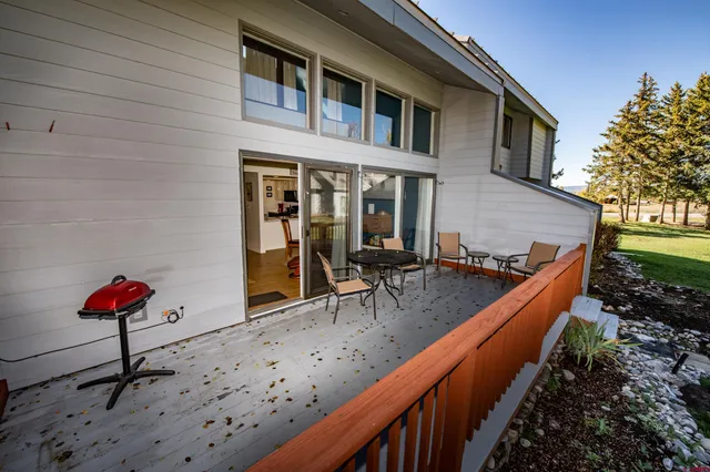 a backyard of a house with seating space