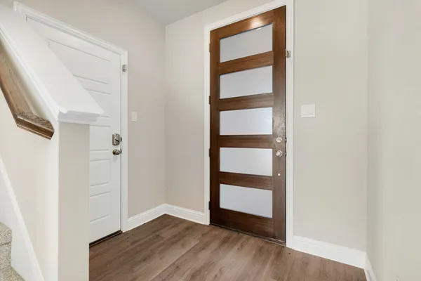 an empty room with wooden floor