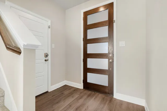 an empty room with wooden floor