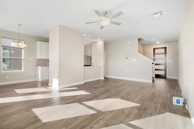a view of a livingroom with wooden floor