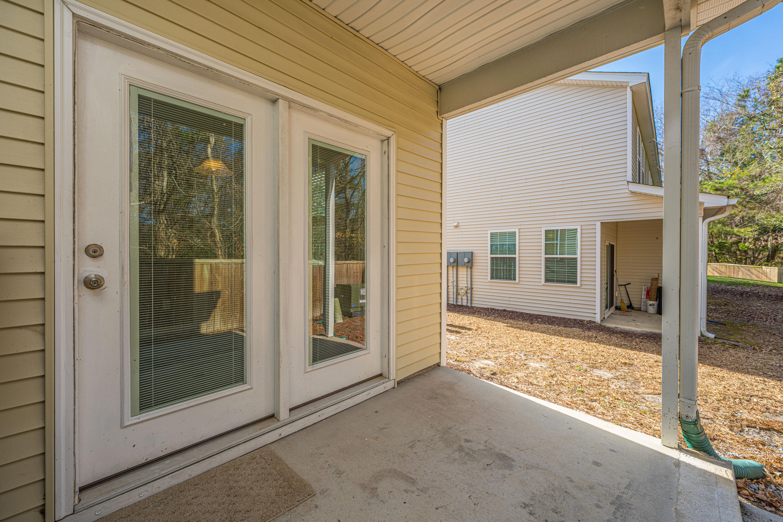 1076 Lexi Court Ladson, SC 29456 - Photo 22 of 27 Covered Rear Porch