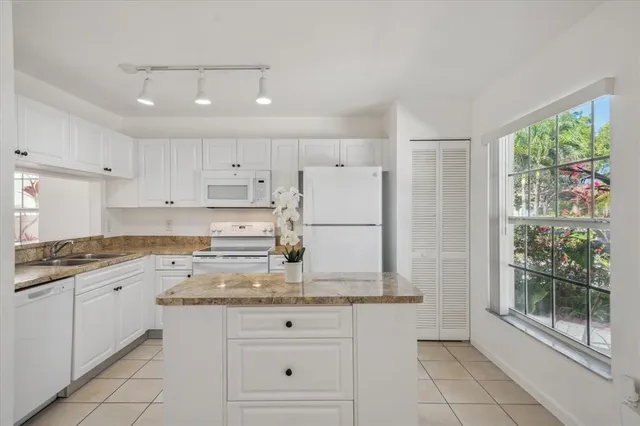 a view of a dining room that has a table and a chair in it