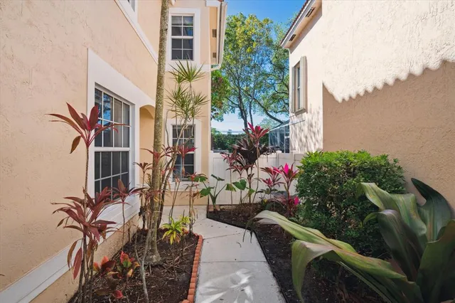 an aerial view of a house with a yard and lake view