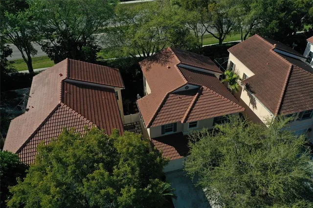 an aerial view of a house with outdoor space and street view