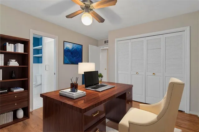 a view of an empty room and wooden floor