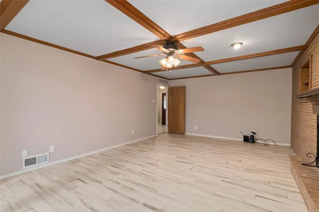 a aerial view of a house with a yard and garden