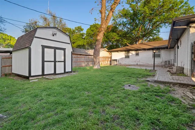 a house with green field in front of it