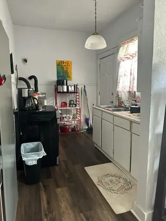 a utility room with sink dryer and washer