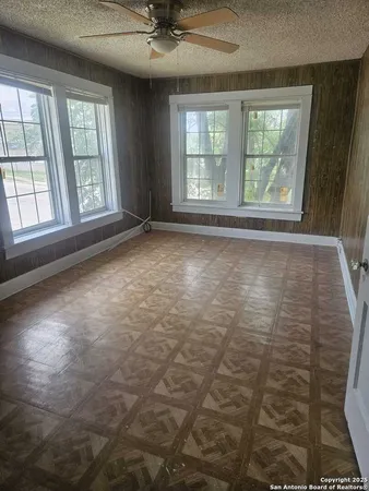 a room with a sink and cabinets