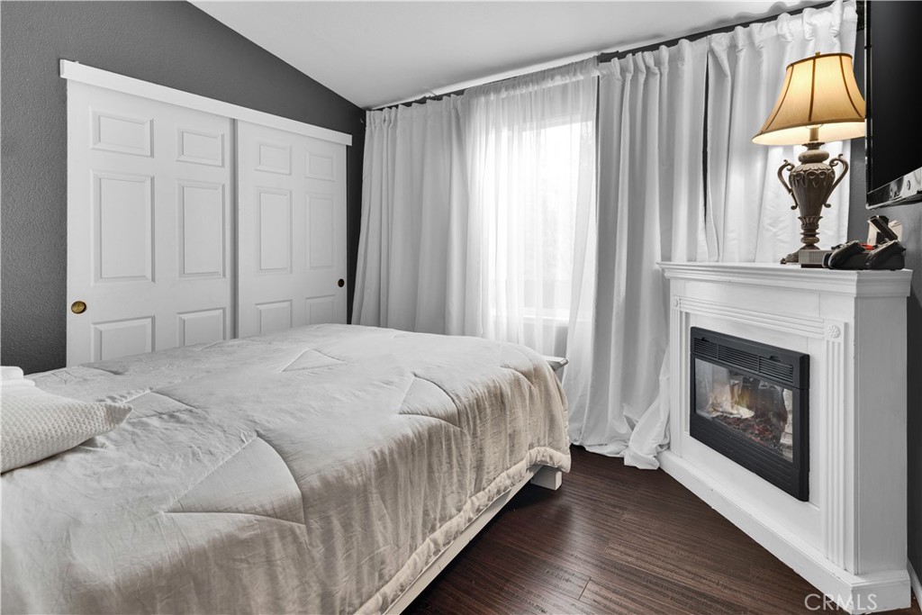 115 Via Robles Paso Robles, CA 93446 - Photo 12 of 23 a bedroom with a bed and a fireplace