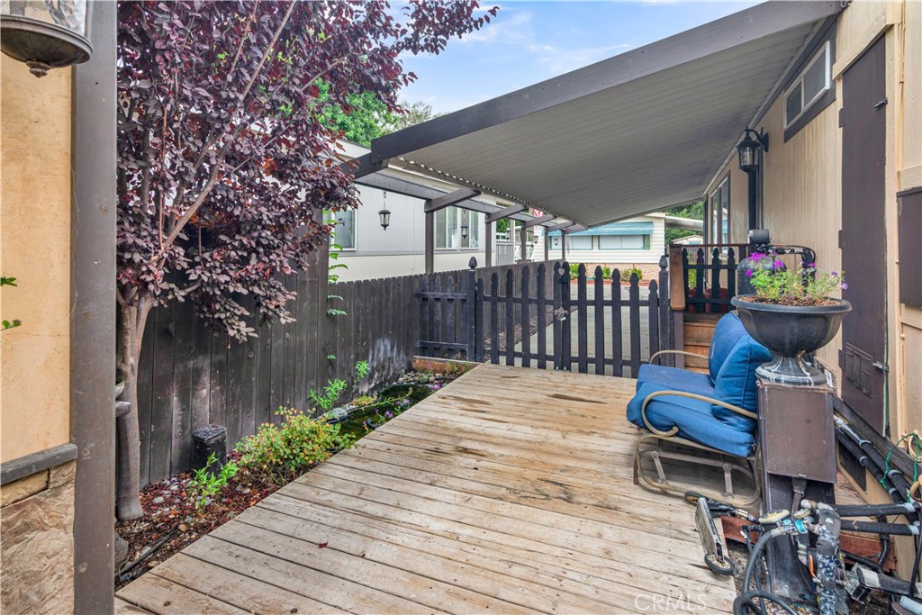 115 Via Robles Paso Robles, CA 93446 - Photo 22 of 23 a wooden bench sitting in front of a building