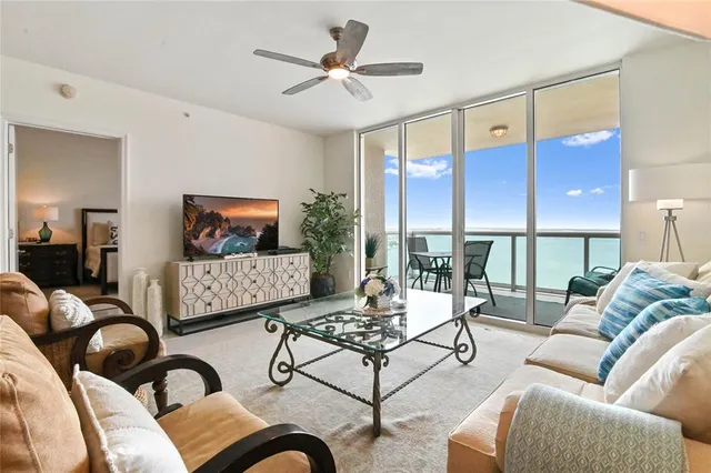 a living room with furniture and a large window