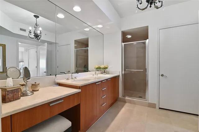 a bathroom with a sink double vanity and a mirror