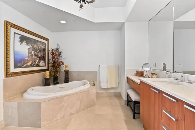 a view of a kitchen with a sink and a refrigerator