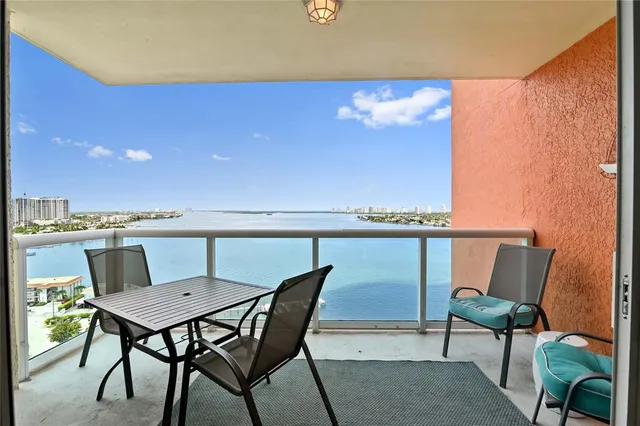 a view of a dining room with furniture and a potted plant