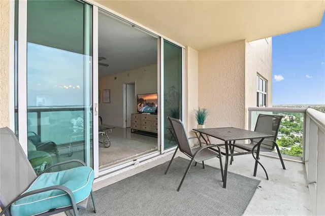 a view of a room with a table and chairs