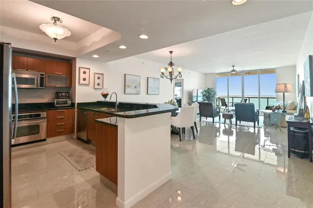 a kitchen with counter top space cabinets and stainless steel appliances