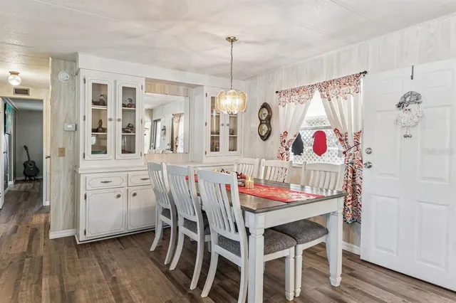 a view of a dining room with furniture and window