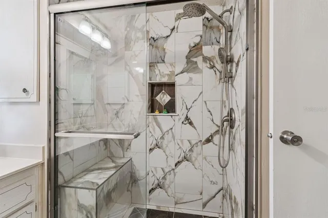 a bathroom with a double vanity sink and mirror