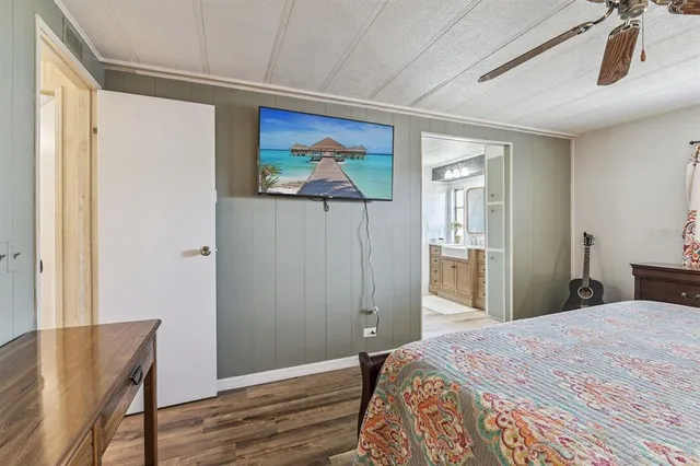 a spacious bathroom with a shower a sink and a mirror