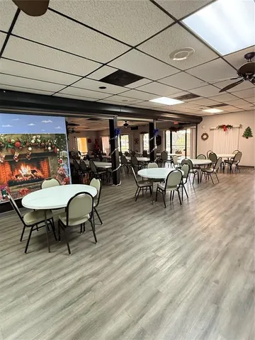 a view of a livingroom with furniture and a flat screen tv