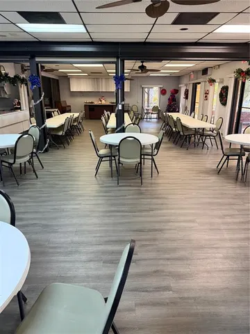 a view of a patio with table and chairs