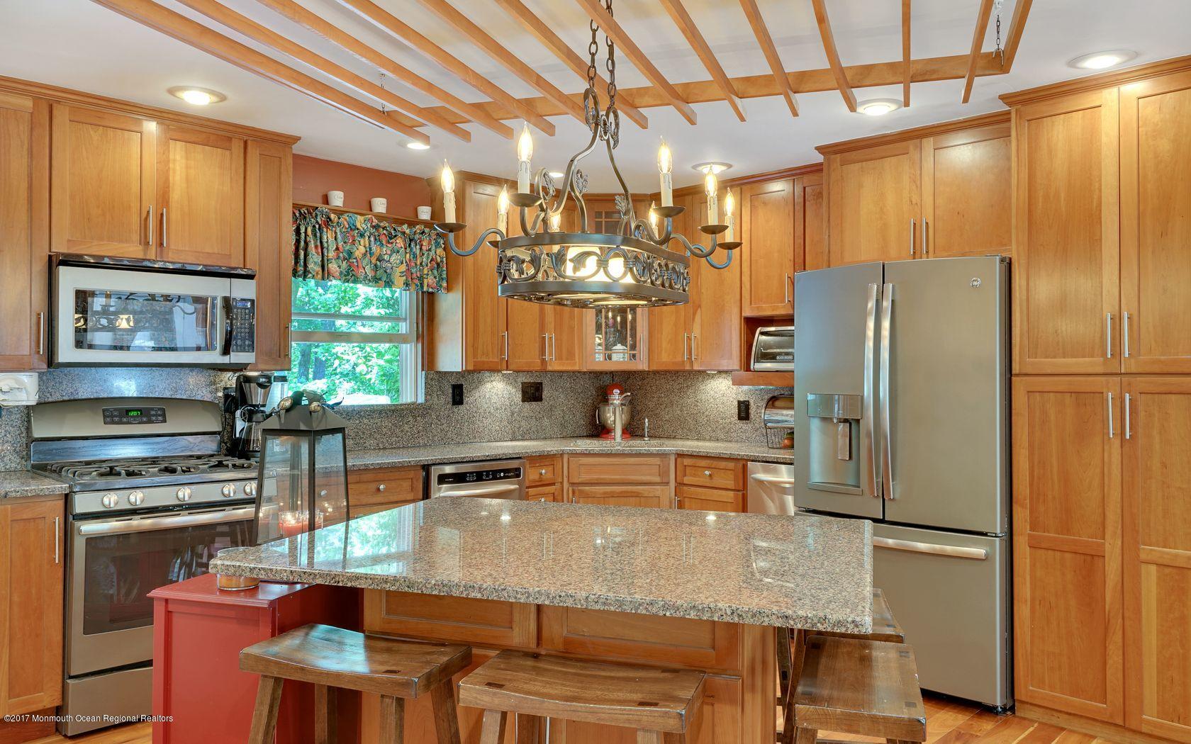 340 Jackson Pines Road Jackson, NJ 08527 - Photo 16 of 41 a kitchen with refrigerator and chairs