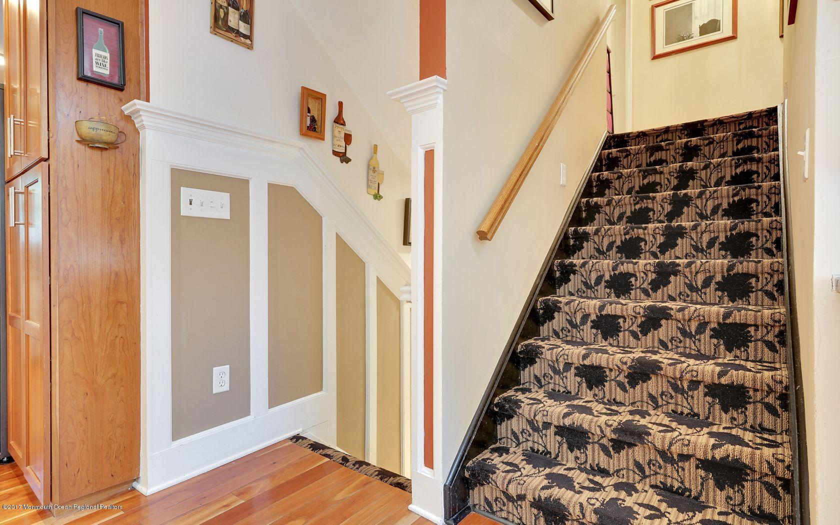 340 Jackson Pines Road Jackson, NJ 08527 - Photo 17 of 41 a view of a hallway with wooden floor and staircase