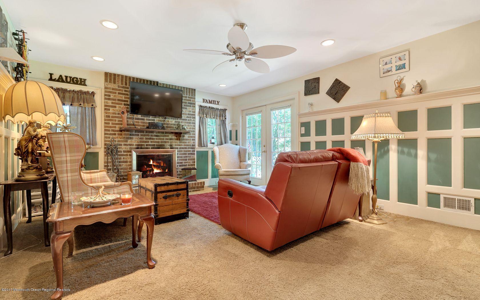 340 Jackson Pines Road Jackson, NJ 08527 - Photo 18 of 41 a living room with furniture fireplace and flat screen tv