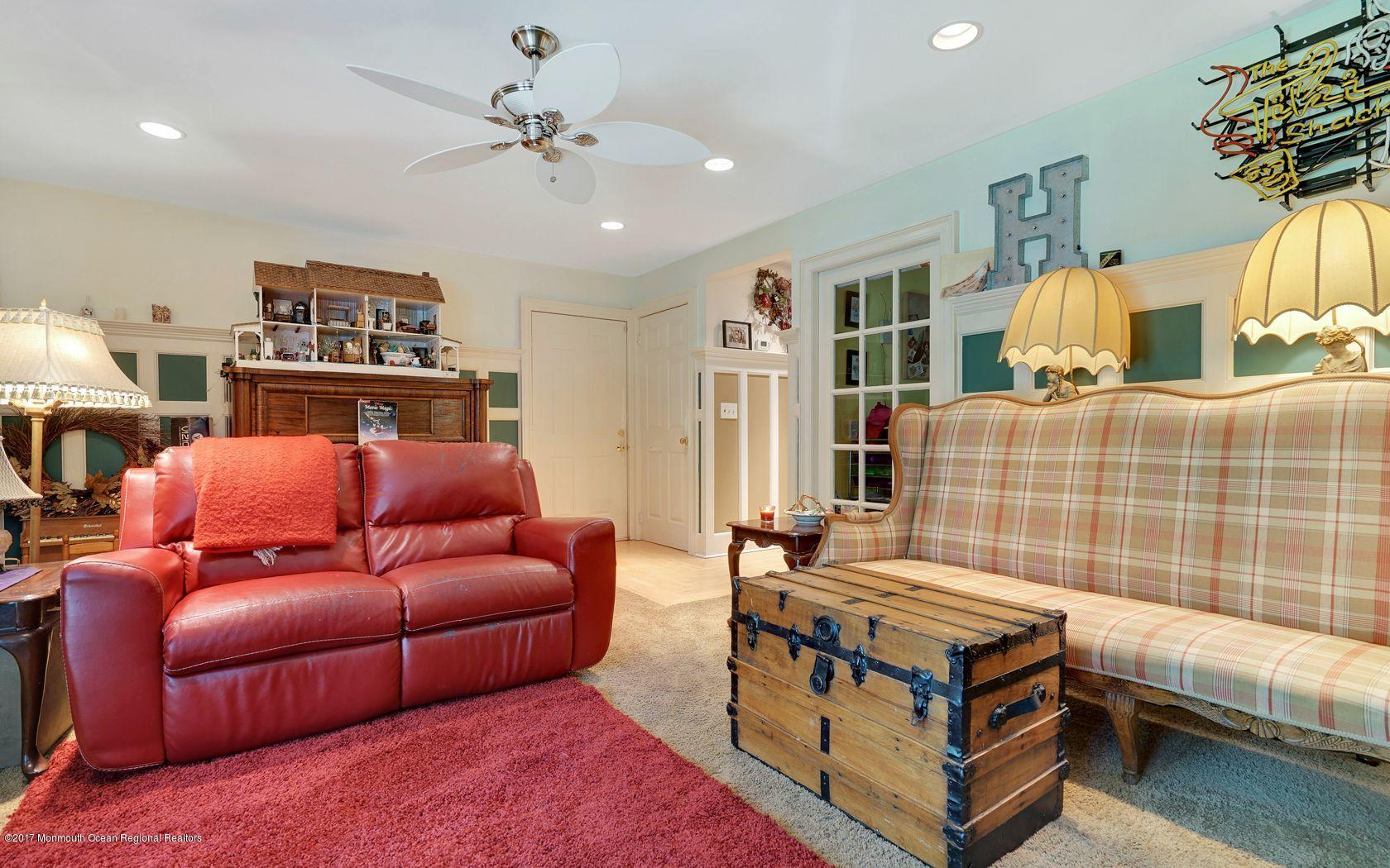 340 Jackson Pines Road Jackson, NJ 08527 - Photo 19 of 41 a living room with furniture and a chandelier