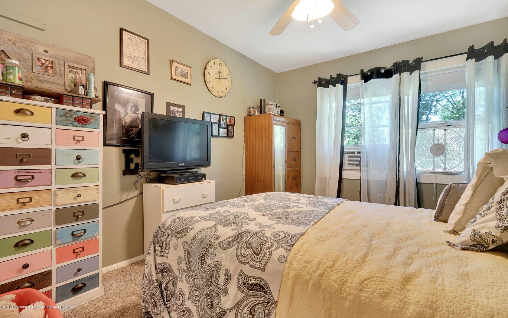 340 Jackson Pines Road Jackson, NJ 08527 - Photo 20 of 41 a bedroom with a bed a flat screen tv and a window