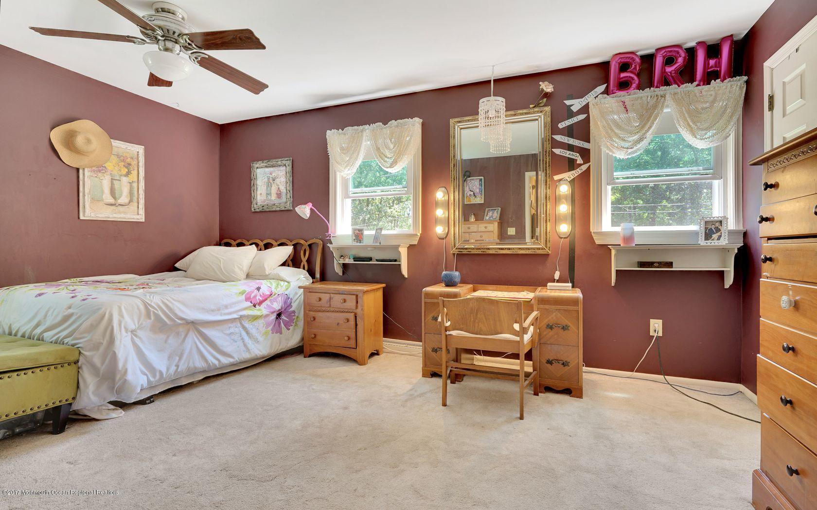 340 Jackson Pines Road Jackson, NJ 08527 - Photo 22 of 41 a bedroom with a bed and a large window