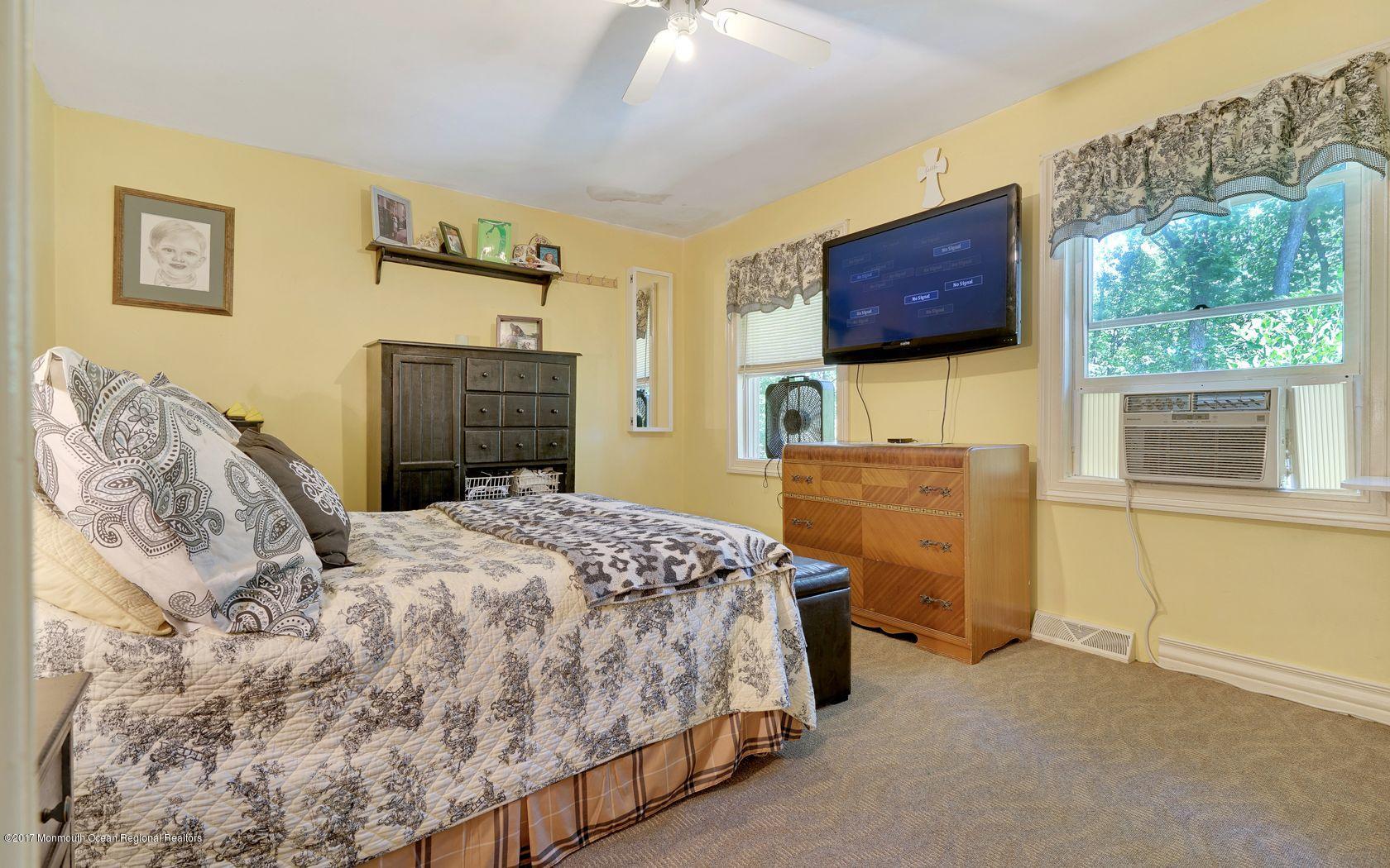 340 Jackson Pines Road Jackson, NJ 08527 - Photo 23 of 41 a bedroom with a bed and a window
