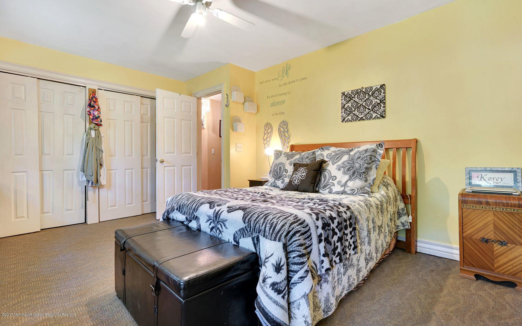 340 Jackson Pines Road Jackson, NJ 08527 - Photo 24 of 41 a bedroom with a bed and a couch